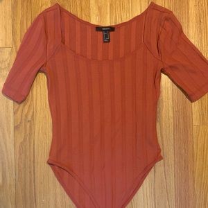 Orange bodysuit. Never been worn